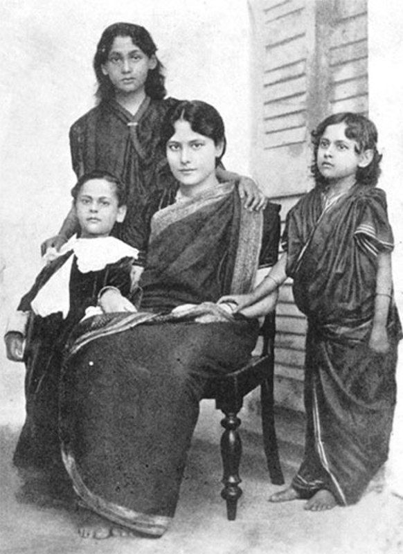 Rabindranath Tagore's son Rathindranath Tagore (standing behind) and daughters Madhurilata Devi (Bela) (sitting on the chair), Mira Devi, and Renuka Devi