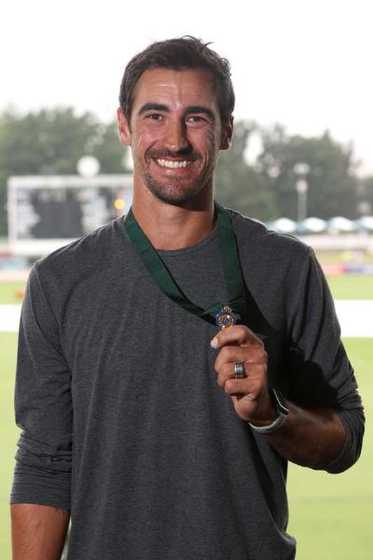 Mitchell Starc with the Allan Border Medal at Manuka Oval, Canberra