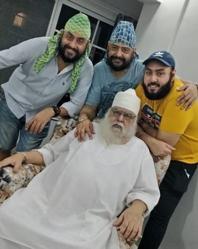 Balvinder Singh Suri with his father (sitting) and son (in yellow t-shirt)