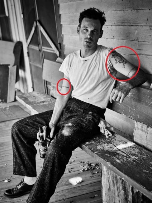 A photo of tattoo's innked on Scoot McNairy's right and left hand