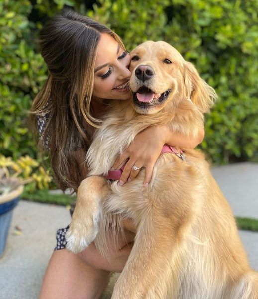 Alex Biston with her Golden Retriever