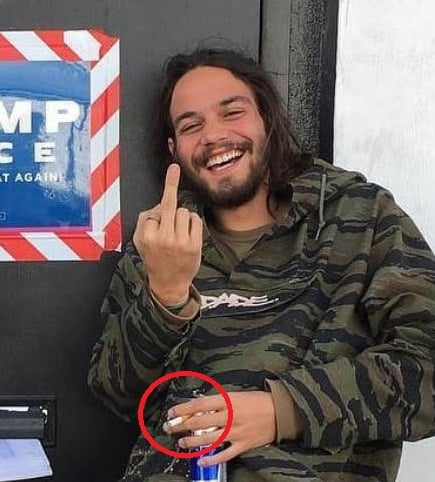 Daniel Zovatto holding a cigarette