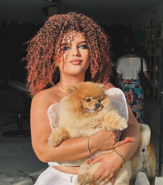 Gresa Gashi with a Pomeranian