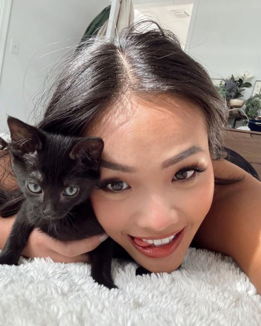 Jenn Tran with a kitten