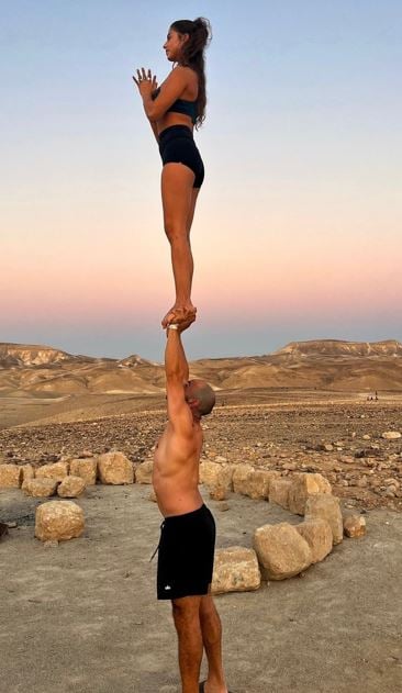 Noa Cohen doing acro yoga