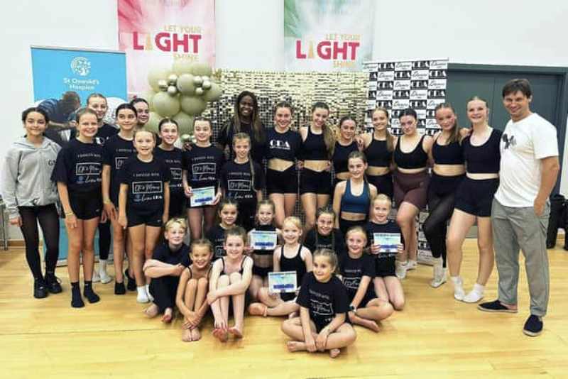 Oti Mabuse (centre) and Marius Iepure (extreme right) along with their students at the Oti & Marius Dance Studio