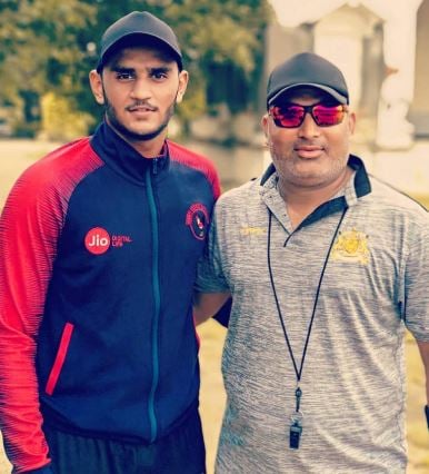 Urvil Patel with his coach, Prakash Patni