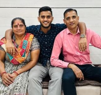 Urvil Patel with his parents