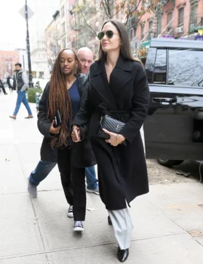 Zahara Marley Jolie-Pitt with Angelina Jolie during a trip