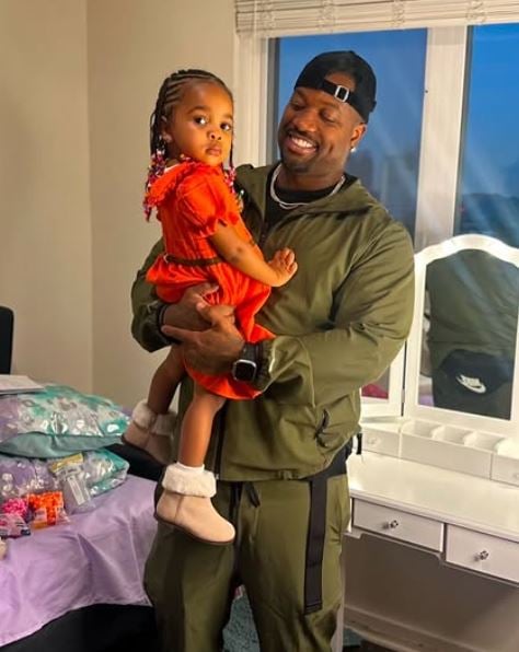 Jamar Champ with his daughter