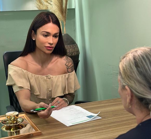 Diana Areas with a client at her clinic