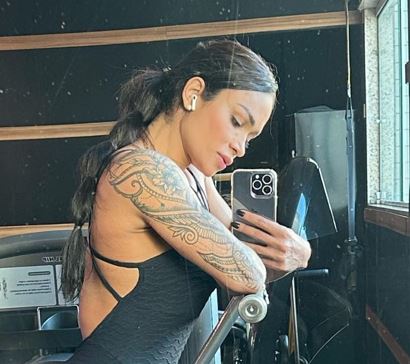 Tattoos on left arm of Diana Areas