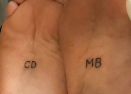 Charlotte D'Alessio and Madison Beer tattooed each others initials on the middle of their feet