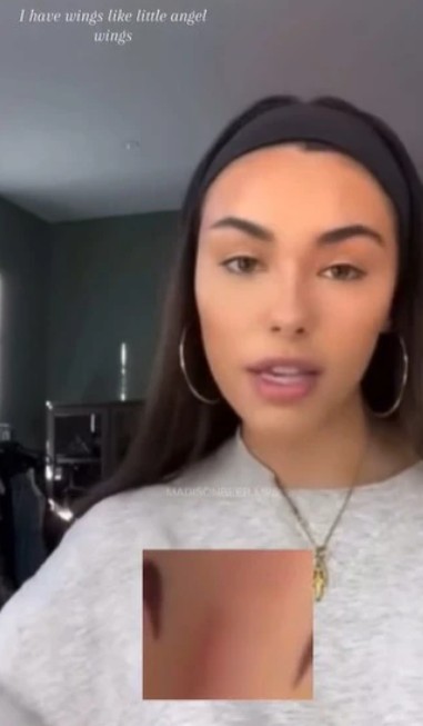 Madison Beer revealing her wings tattoo on her right foot during a livestream