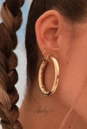 Madison Beer's 'Baby' tattoo on the right side of her neck