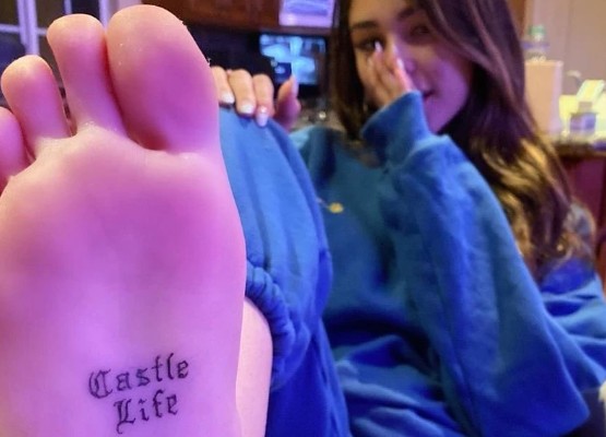 Madison Beer's 'Castle Life tattoo on the middle of her right foot