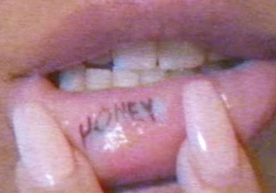 Madison Beer's HONEY tattoo on the inner side of her lower lip