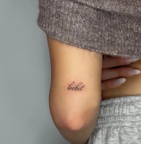 Madison Beer's 'Locket' tattoo on the back side of her right arm