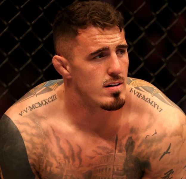 Roman numerals on Tom Aspinall's collarbones