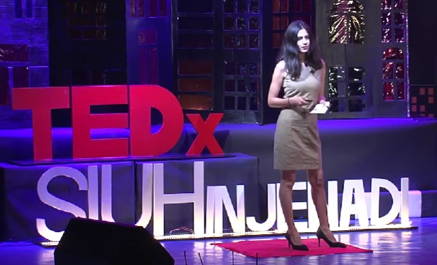 Runjhun Sharma while delivering a lecture on TEDx Talk