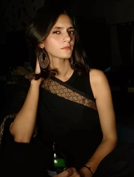 Runjhun Sharma while enjoying an alcoholic beverage