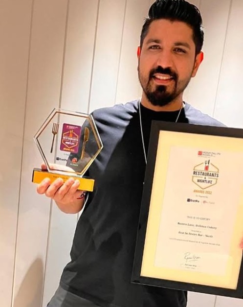 Saurabh Luthra posing with his awards