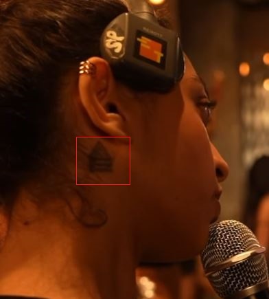 Shazia Samji's tattoo behind the ear