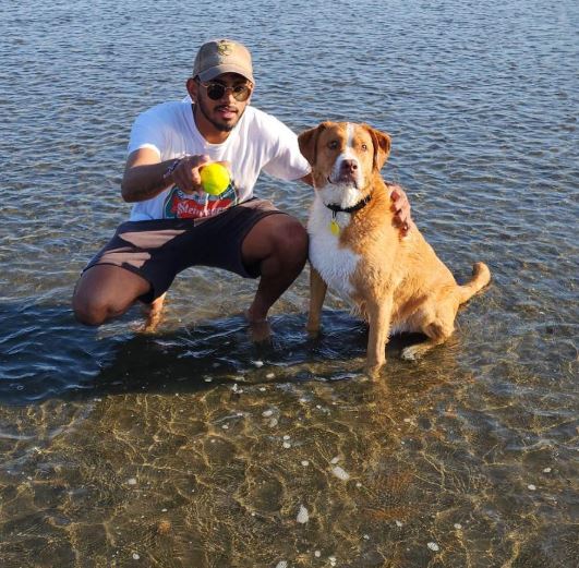 Adithya Ashok with his dog