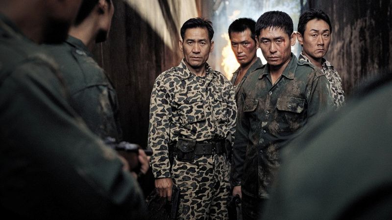 Ahn Sung-ki (extreme left) as 'Commandant Choi Jae-hyeon' in a still from the film 'Silmido' (2003)