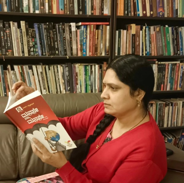 Asha Raghu while reading a book in her library