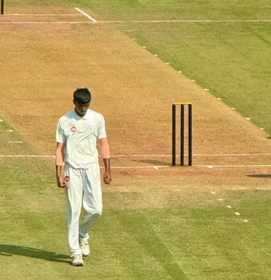 Henil Patel while bowling during a match in 2023-2024
