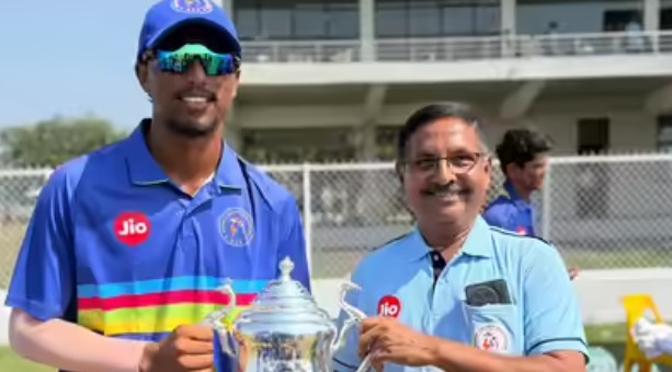 Henil Patel with his coach, Hemant Panchal