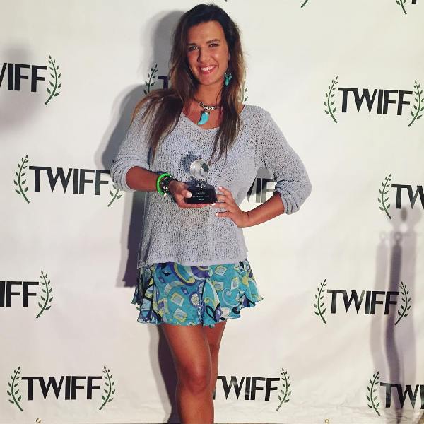 Natalie Burn with the Best Narrative Feature award, which she won at the 2015 TWIFF