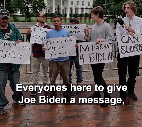 Nick Shirley with some immigrants with pro-Biden and pro-immigration signs near the White House