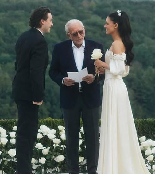 Nicola Peltz and her husband, while taking their wedding vows for the second time in August 2025