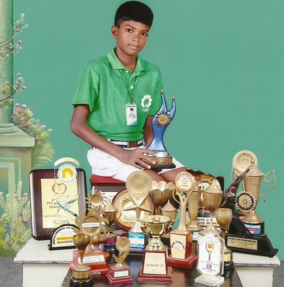 A childhood picture of Dhakshineswar Suresh with his prizes