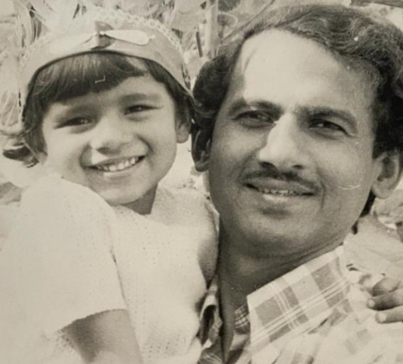 A childhood picture of Irina Ghose with her father