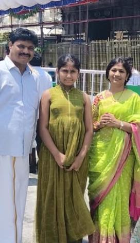 B Sumathi with her husband and daughter