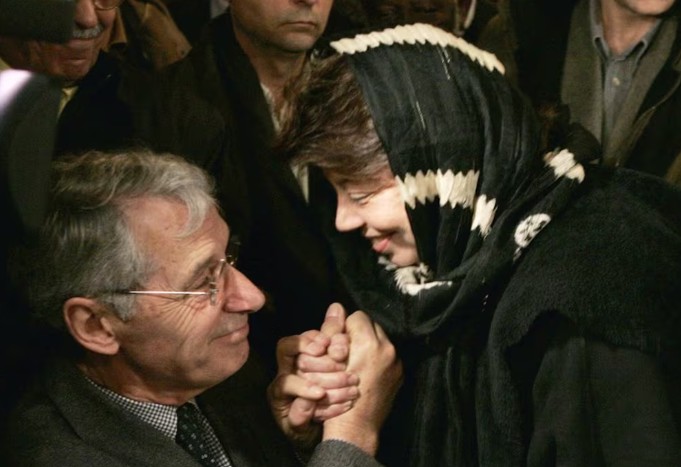 Benoit Aubenas, left, the father of French journalist Florence Aubenas, who has been missing in Iraq since 5 January 2005, being comforted by Palestinian envoy to France Leila Shahid during a gathering ceremony as part the Eid Al Adha at the Paris Mosque