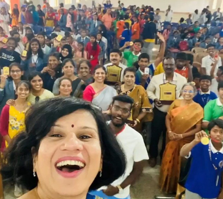 Irina Ghose posing with the students and teachers of her Little Bit organisation