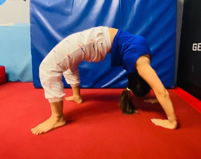 Redheemaa, while practicing yoga