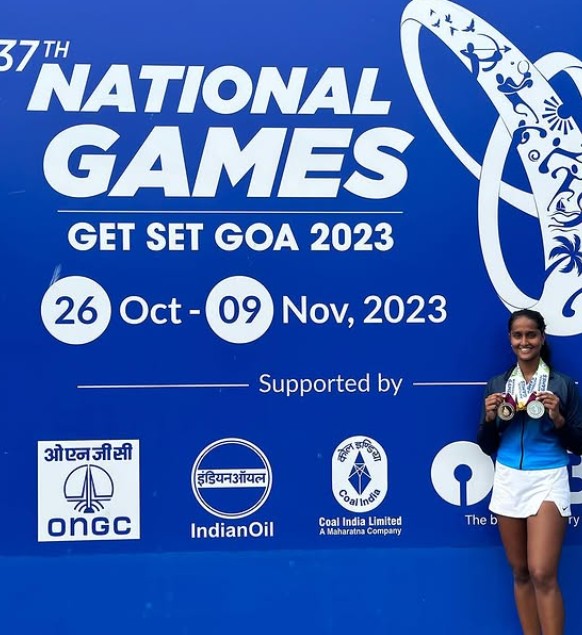 Vaishnavi Adhkar posing with her medals at the National Games organised in Goa in 2023