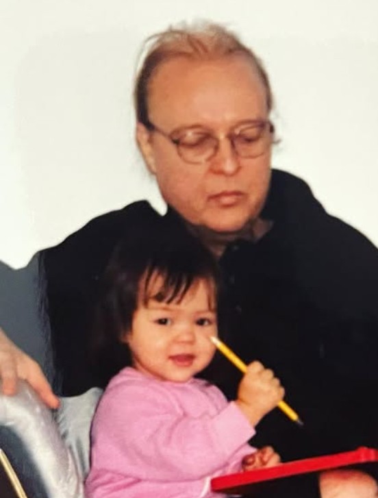 A childhood picture of Maya Kibbel with her father
