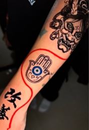 Different tattoos on Aishwarya's hand