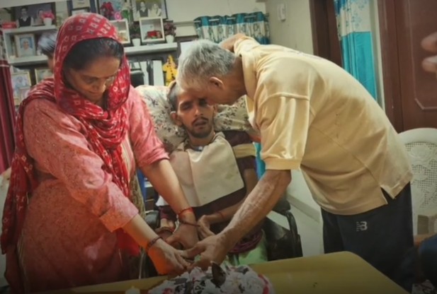 Harish Rana's parents while celebrating his birthday