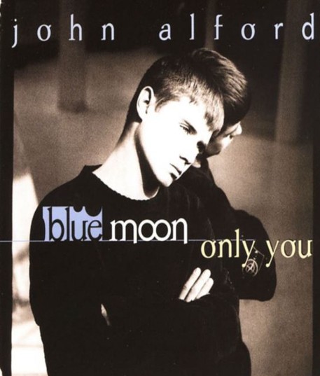 John Alford on the poster of the music video of the song Blue Moon