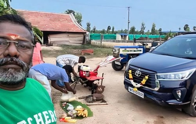 Karunas posing with his Toyota Innova Crysta