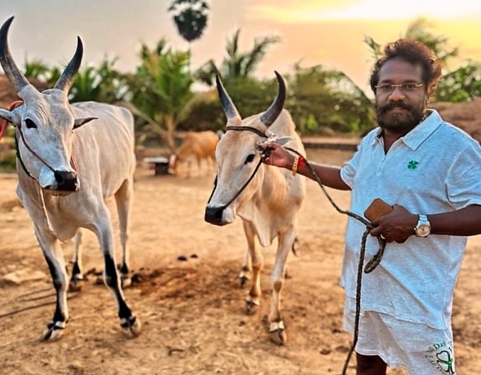Karunas posing with his live stock