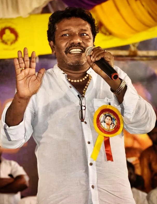 Karunas while delivering a speech during a political rally