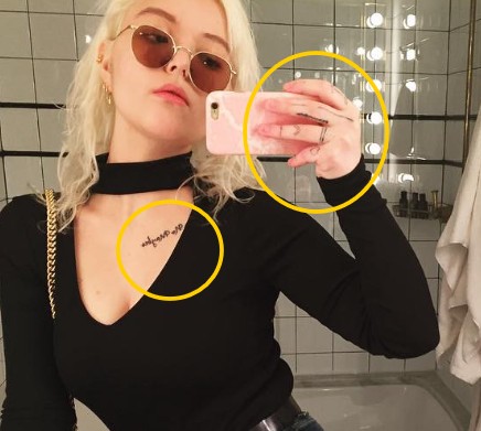 Maya Kibbel's tattoos on her left hand fingers and collarbone